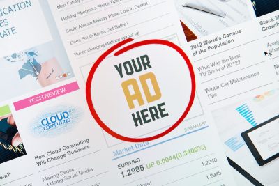 Online internet banner with text "YOUR AD HERE" on a web page illustrating concept of making money online by posting ads.